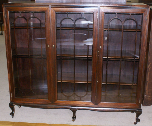 Petite walnut antique triple door bookcase